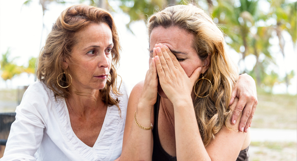 woman consoling another